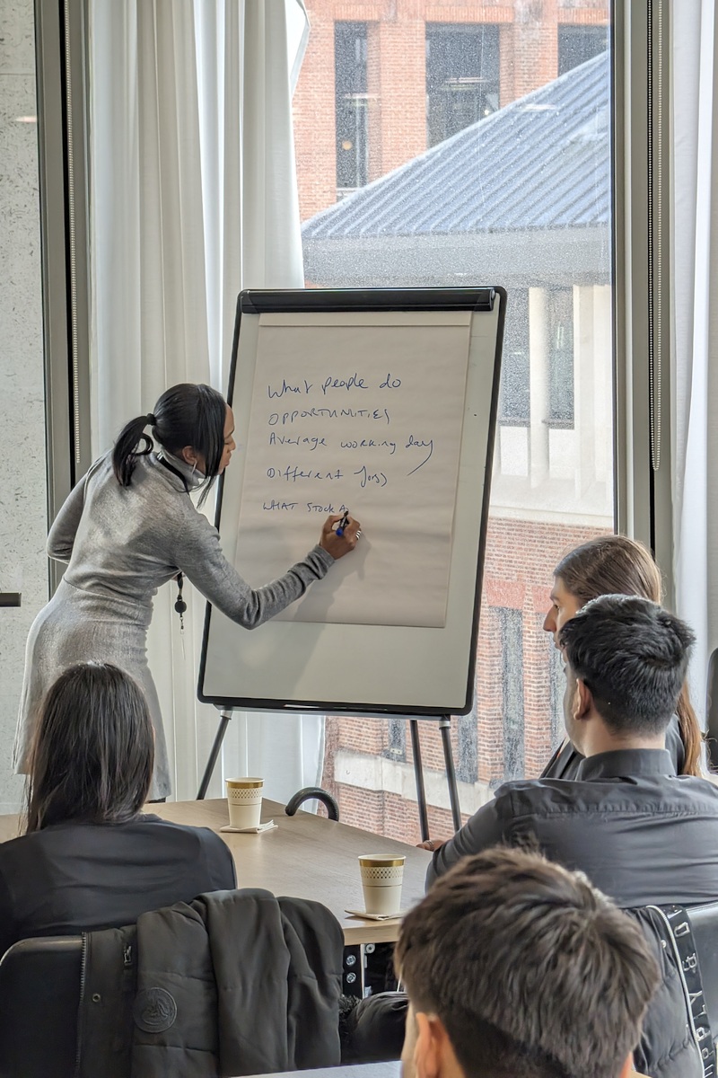 CEO Leila Thomas at Talent Accelerator writing on a flipchart about what young people want to learn about the workplace